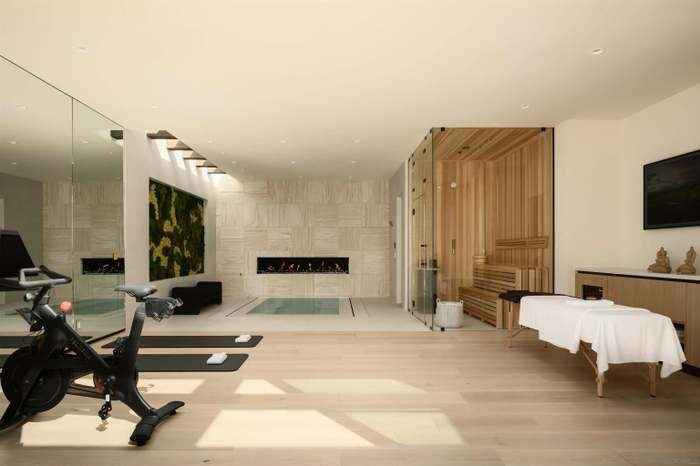 Full spa wing with sauna, cold plunge, Peloton, and massage table